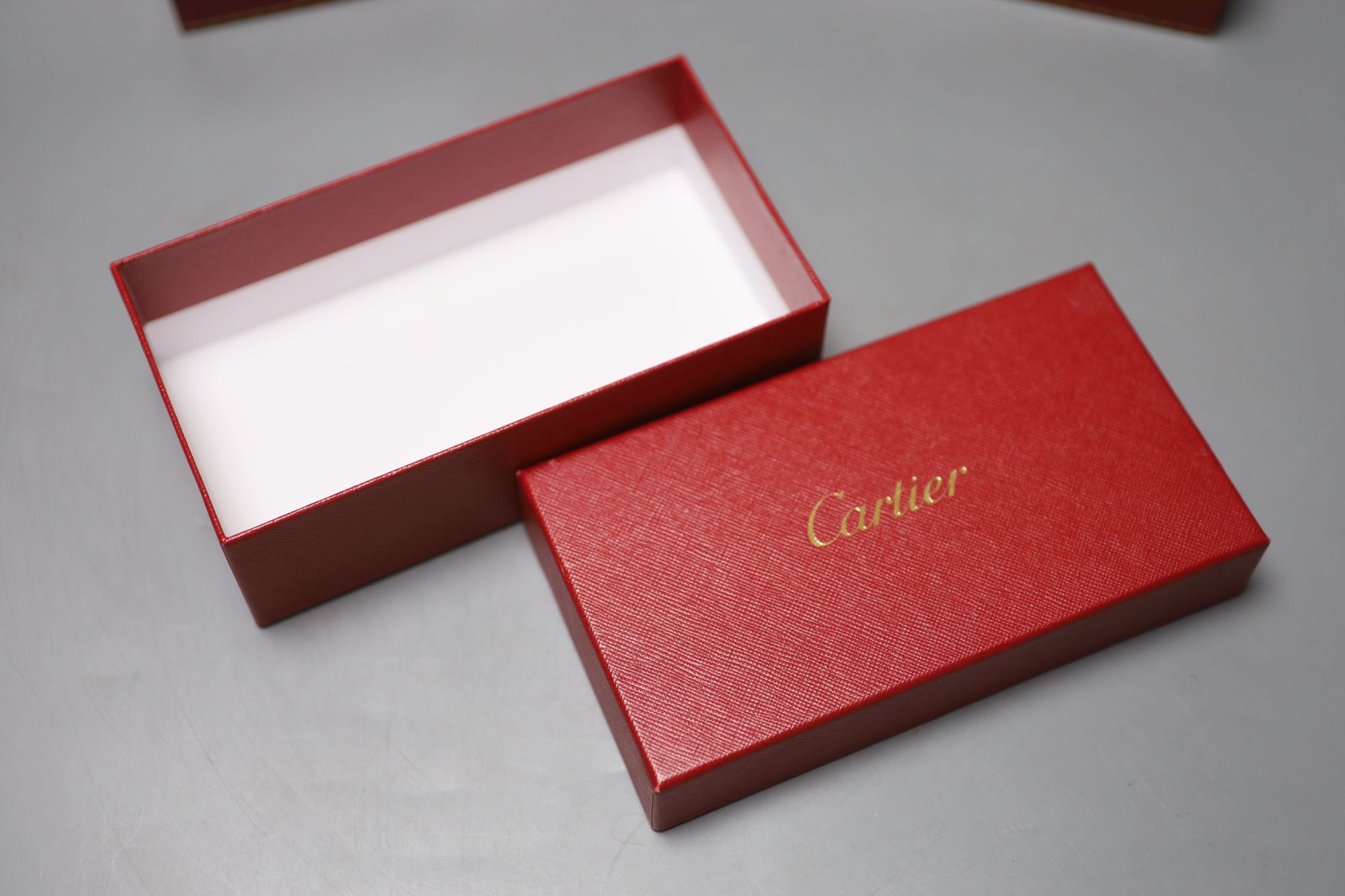 Three modern Cartier fitted jewellery boxes and one other Cartier box.